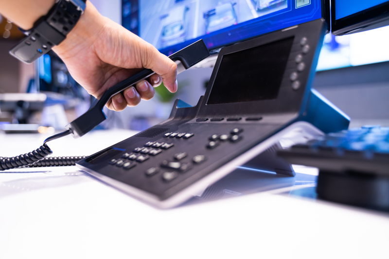 hand-is-picking-up-phone-notify-news-office